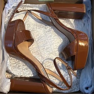 Never worn brown Steve Madden platform heels